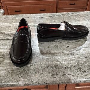 NEW, NEVER worn, Rockport, black polished penny loafer, 9.5